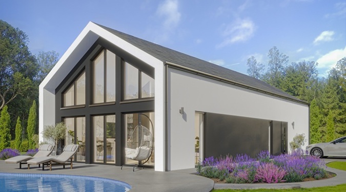 Elegant collection of compact modern barn houses in a woodland setting.
